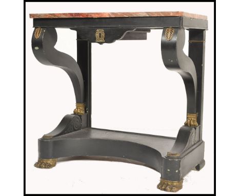 A 19th century French empire rouge marble top console hall table. The ebonised mahogany base with s-scroll supports and gilt 