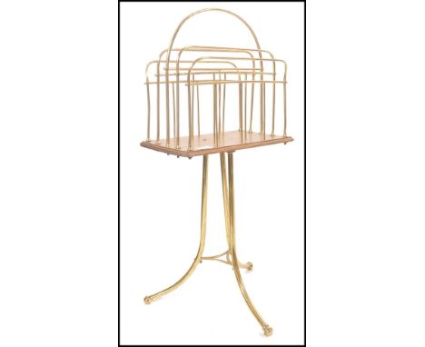 A late&nbsp; 19th century / Edwardian tubular magazine rack - canterbury. The stand set over downswept legs united by periphe