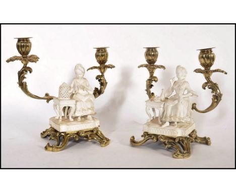 A pair of 18th century Georgian blanque de chine ceramic figurines of ladies seated raised on pedestal bases. One figure mode