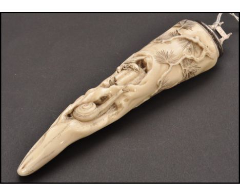 A 19th century Chinese silver mounted marine ivory tusk carved with a wasp on bamboo, snail amongst rochs&nbsp; and moth atop