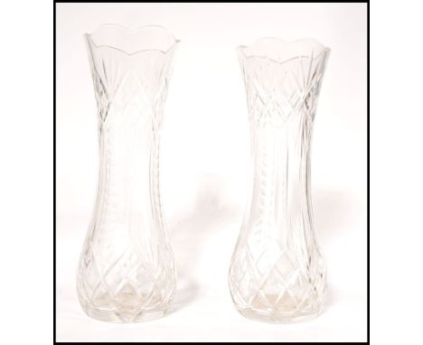 A pair of 20th century cut glass crystal vases, Each being facet cut with a further unusual decoration of graduating spheres 