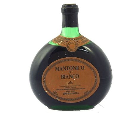 A Mantonico Di Bianco 1978 bottle of white grape Italian wine. 16% appears unopened. Moon flask shaped bottle with paper labe