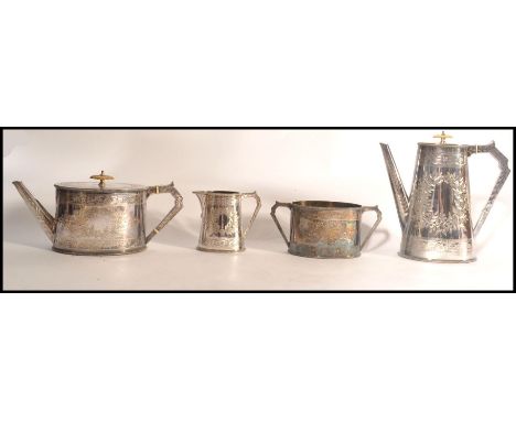 An Elkington &amp; Co 4 piece silver plated tea service being chased with wreath and central monograms to include teapot coff