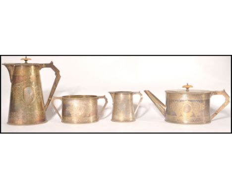 An Elkington &amp; Co 4 piece silver plated tea service being chased with wreath and central plain cartouche panels to includ