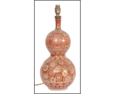 A Japanese Meiji period double gourd Kutani vase. Decorated with millefiori patterns of geometric shapes and chrysanthemums. 