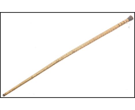 A 19th century nautical walking stick cane of shark vertebrae and baleen construction being of tapering form having a baleen 