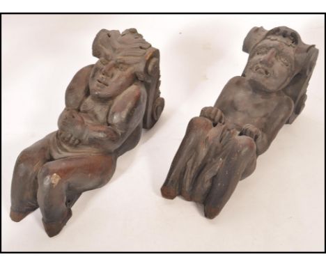 A pair of 18th / 19th century Gothic architectural carved pine wall brackets - mounts. Of flemish design each with s-scroll t