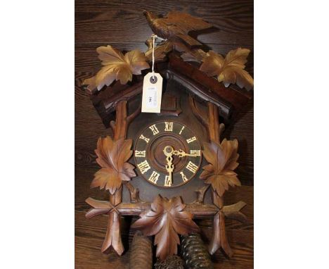 IMPRESSIVE CARVED WOOD BLACK FOREST STYLE ONE DAY CUCKOO CLOCK
with an intricately carved bird pediment over the cuckoo windo