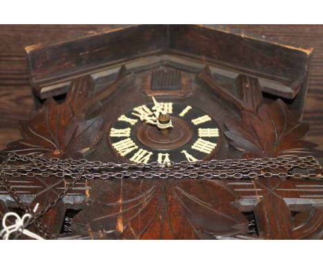 EARLY 20TH CENTURY CARVED WOOD BLACK FOREST CUCKOO CLOCK
black chapter ring with Roman numerals in white, pediment and pendul