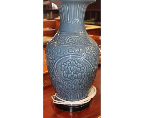 PAIR OF LARGE BLUE CERAMIC VASE LAMPS
with scrolling detail, on short ebonised stands with square cream shades, each lamp 55c