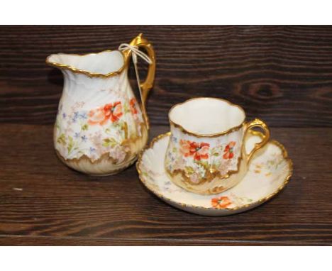 LIMOGES FLORAL AND GILT TEA SERVICE
with hand-painted floral decorations and gilt edges, comprising tea cups, saucers, side p