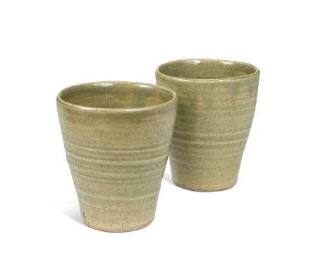 § David Leach OBE (1911-2005), a pair of celadon glazed stoneware tumbler cups, of tapering cylindrical form, impressed seal 