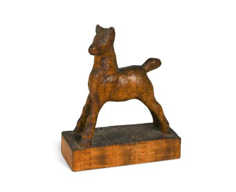 § Attributed to Arthur W. Simpson (1857-1922) of Kendal, a carved wood model of a foal,  probably satin birch, chip carved to