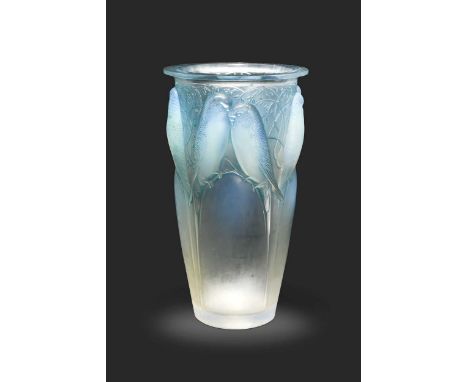 Ceylan, an R. Lalique opalescent glass vase, designed 1924, the blue tinted body of gently tapering form and moulded in high 