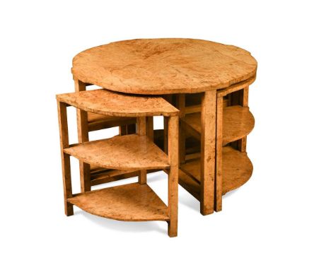 An Art Deco maple nest of tables,  with a shaped circular quarter-veneered top above four shaped triangular three-tier side t