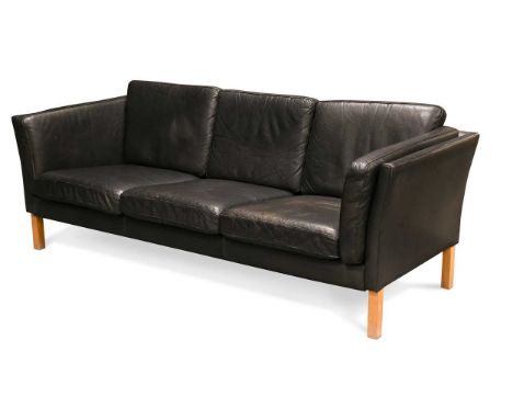 A Danish black leather three seat sofa,  with loose cushions and arms raised on beech legs73 x 193 x 80cm