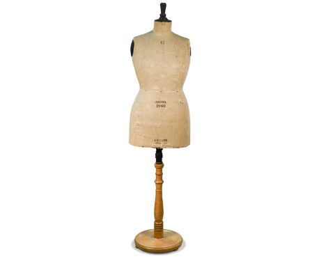 A vintage Stockmann style female mannequin, by 'LEVINE Paris-London', of large scale and mounted on a pale oak base175 x 42cm