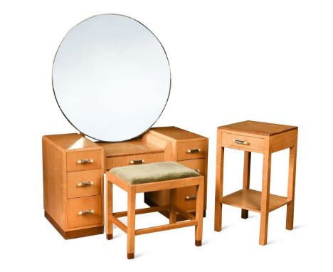 An Art Deco satin walnut bedroom suite,  comprising dressing table with large circular mirror back above a sunken surface wit