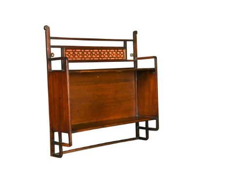 A set of Anglo-Japanese Aesthetic Movement mahogany wall shelves,  with silk lined fretwork panel above two shelves60 x 57 x 