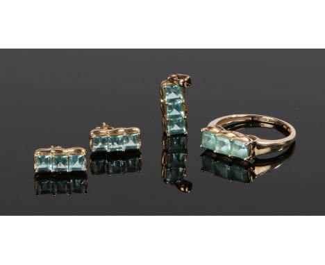 9 carat gold ring, pendant and earrings, all set with light blue stones (4)