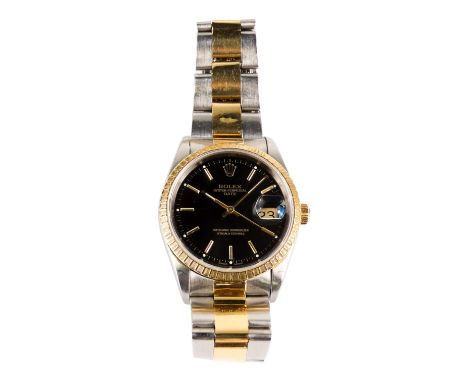 A Rolex Oyster Perpetual Datejust automatic wristwatch chronometer - the black dial with gold coloured baton hands, five minu