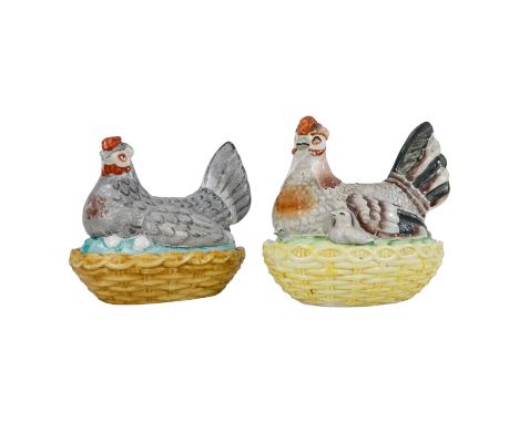 An early 20th century egg caddy - modelled in the form of a hen seated on a wicker nest, 21cm high, together with another sim
