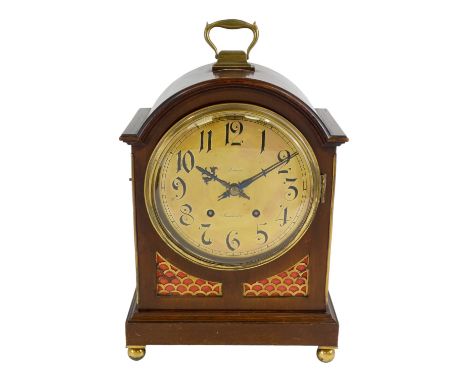 An early 20th century mahogany bracket clock - Beaver of Manchester, the case with fish-scale panels and raised on ball feet,