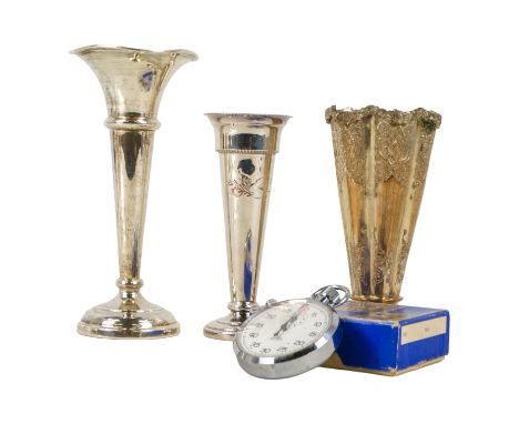 A silver trumpet shaped stem vase - Birmingham 1975, together with two other stem vase and a stopwatch