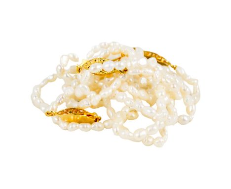 A pair of serd pearl necklaces - with gilt metal clasps, together with a similar pair of bracelets 