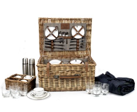 A wicker-cased four-person picnic set for Rolls-Royce, by W Gadsby &amp; Son,the wicker basket with leather handle and straps