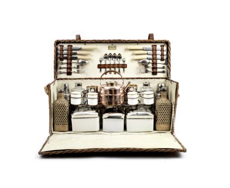 A 'Coracle' wicker-cased picnic set for four persons by G.W.Scott &amp; Sons, 1930s,the wicker case with leather handles and 