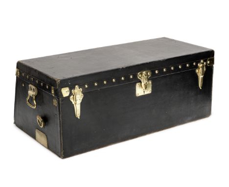 A Louis Vuitton vintage motoring trunk,black Vuittonite exterior with sloped rear, brass lock, catches and brass strap loops 