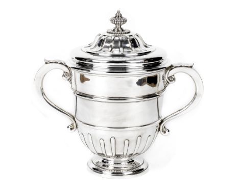 A large sterling silver trophy by William Comyns &amp; Sons Ltd of London 1928,the large classical twin-handled trophy with l