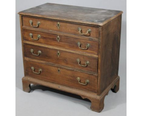 An 18thC mahogany chest, of three long drawers with elaborate handles, surmounted by an overhanging top raised on bracket fee