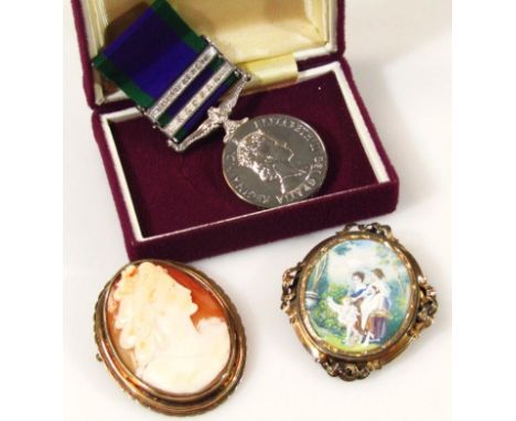 An Elizabeth II campaign service medal, with South Africa and Radfan clasp, with purple and green ribbon, 10cm high, in fitte