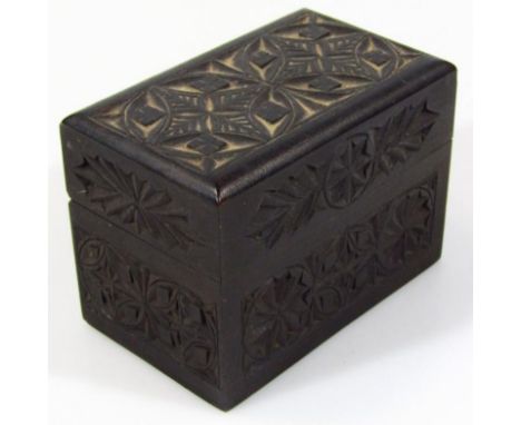 An early 20thC hardwood export card box, decorated with an outer geometric floral pattern, 12cm wide,  and a pack of Chaz Goo