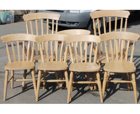 A set of seven (5+2) light beech slat back dining chairs, to include two carvers with comb backs, 116cm high, etc. (7)