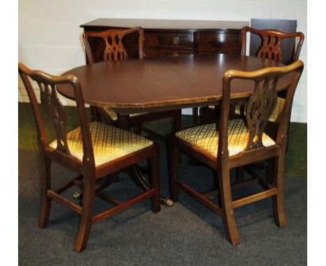 A set of four modern Chippendale design dining chairs, with ribbon back splats and square front supports joined by a 'H' stre