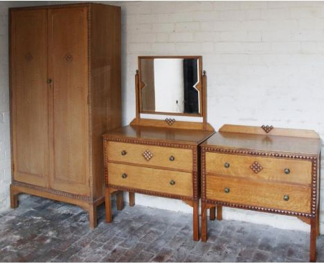 An early to mid-20thC Waring & Gillow three piece light oak bedroom suite, comprising of a two door wardrobe 180cm high, 93cm