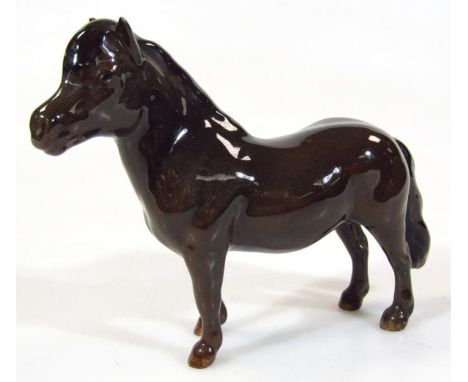 A 20thC Beswick Shetland Pony, (standing), printed marks beneath, 13cm high.