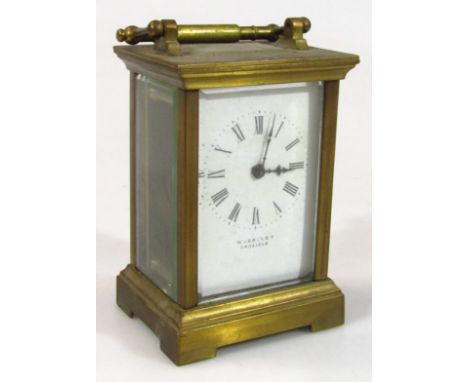 An early 20thC brass cased carriage clock, in five sectional glass case with swing handle and 6cm wide Roman numeric dial mar