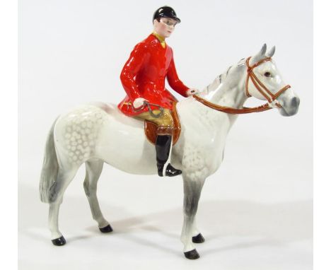 A Beswick red jacketed huntsman on dapple grey horse, printed marks beneath, 23cm high. (AF)