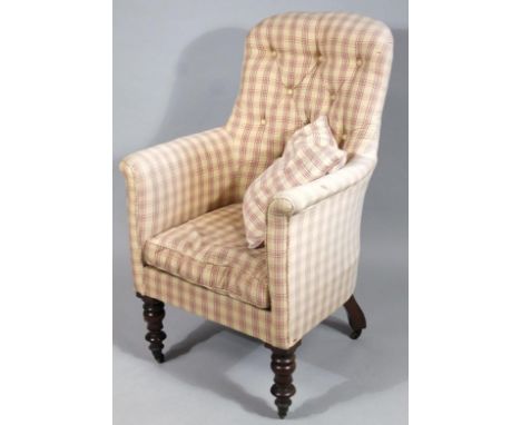 An early 20thC armchair, upholstered in (later) button back striped material on turned supports terminating in castors, 112cm
