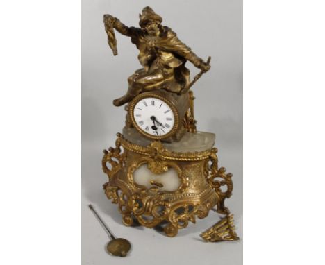 A 19thC gilt metal mantel clock, surmounted by a figure of a huntsman above 8cm dia. enamel dial with elaborate marble case a