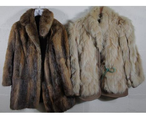 A ladies faux fur coat, in light colours, quarter length, size unknown and another fur coat in brown. (2)