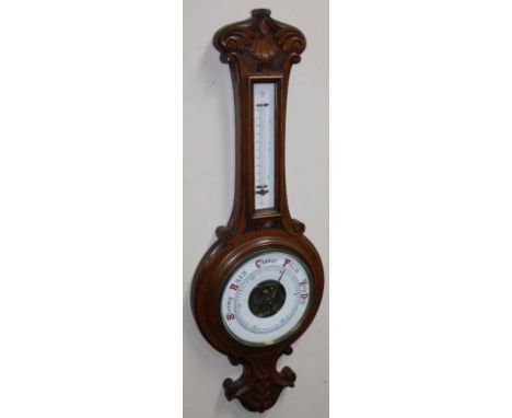 An early 20thC oak cased two dial banjo barometer and thermometer, with 20cm dia. dial in oak case, 76cm high.