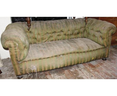 A mid to late Victorian 'D' end button back Chesterfield settee, in green and yellow stripe material, on squat turned front s