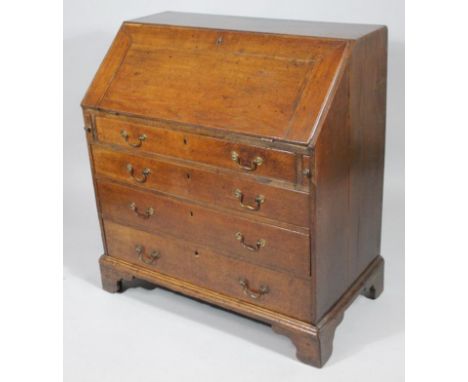 An 18thC oak bureau, with visible dovetails to the top, the fall front revealing a fitted interior, centred by a drawer flank