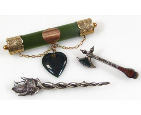 A jade finish brooch, with fancy yellow metal ends marked 9ct, 8cm wide, a twist brooch with boat finial marked Sterling, and