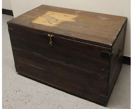 A stripped and lightly stained pine tool chest, of rectangular outline with part metal banding and elaborate handles, the pla